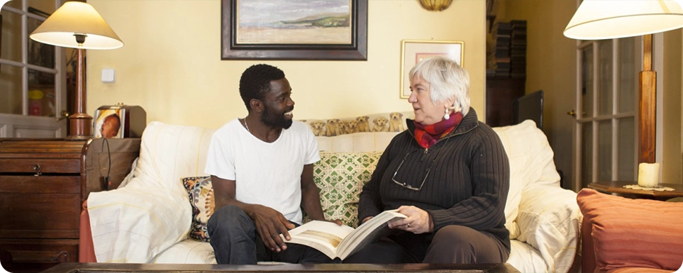 Student talking with a host family member in shared accommodation in Madrid